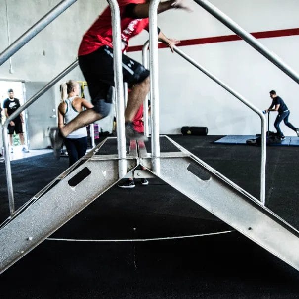 Man running on stairs closeup at Redline Conditioning