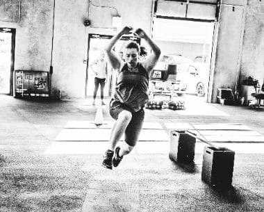 Woman on long jump training at Redline Conditioning